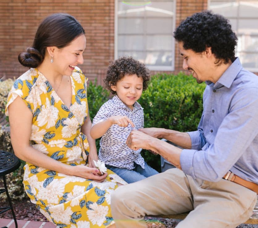Family of three spending time together outdoors
